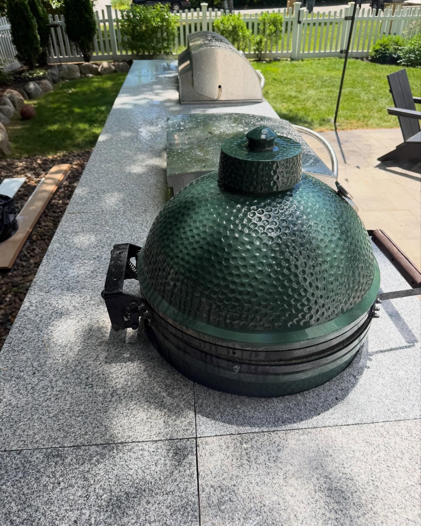 Kamado grill set into a granite outdoor counter