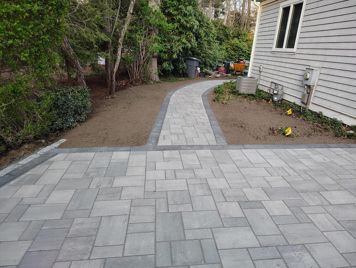 Paver patio joined to a paver walkway