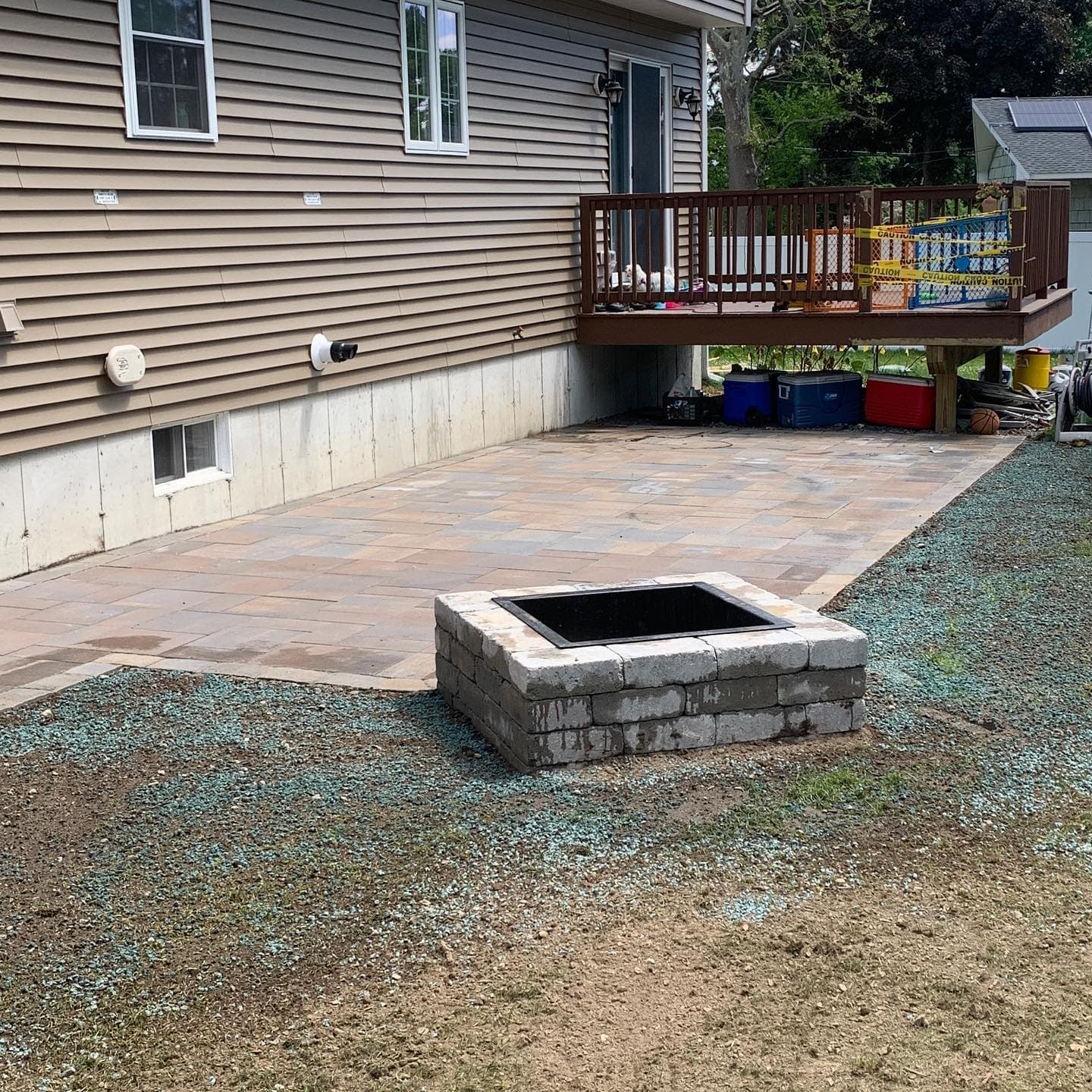 Paver patio with a square fire pit