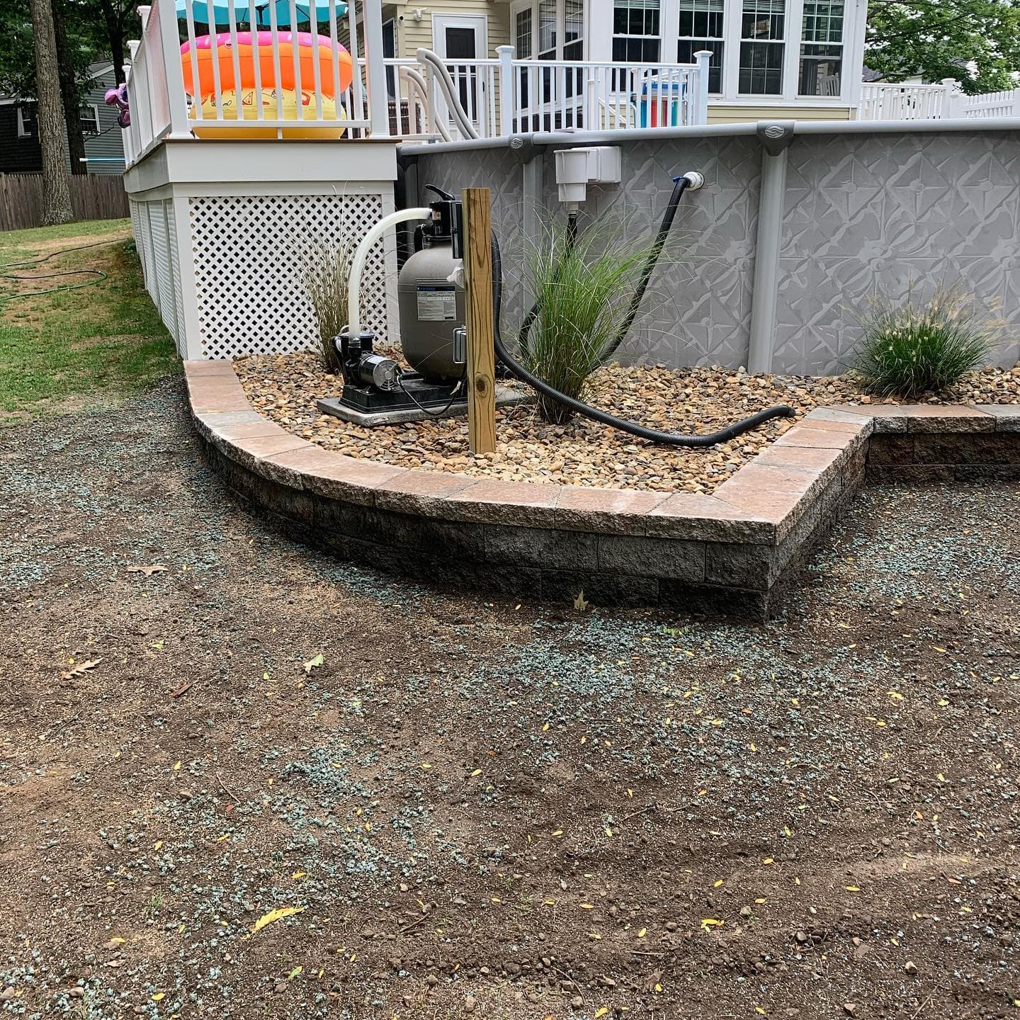 Low block wall around a pool equipment pad