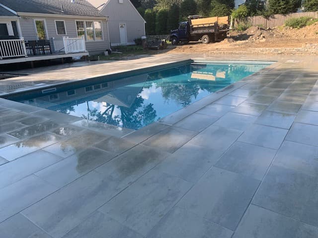 Rectangular pool with a large-format paver slab deck