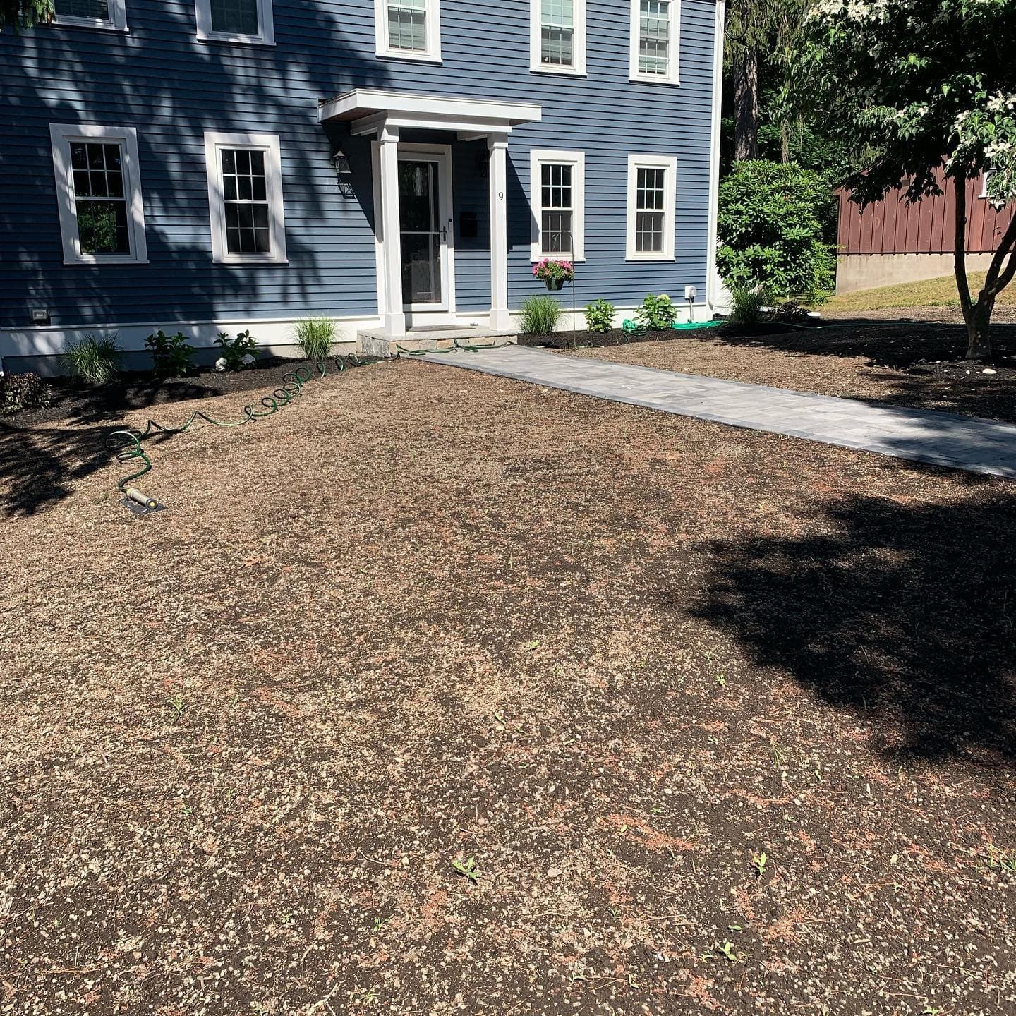 Front yard graded and raked ready for seed