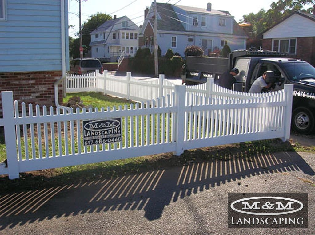 White picket fence along a front yard