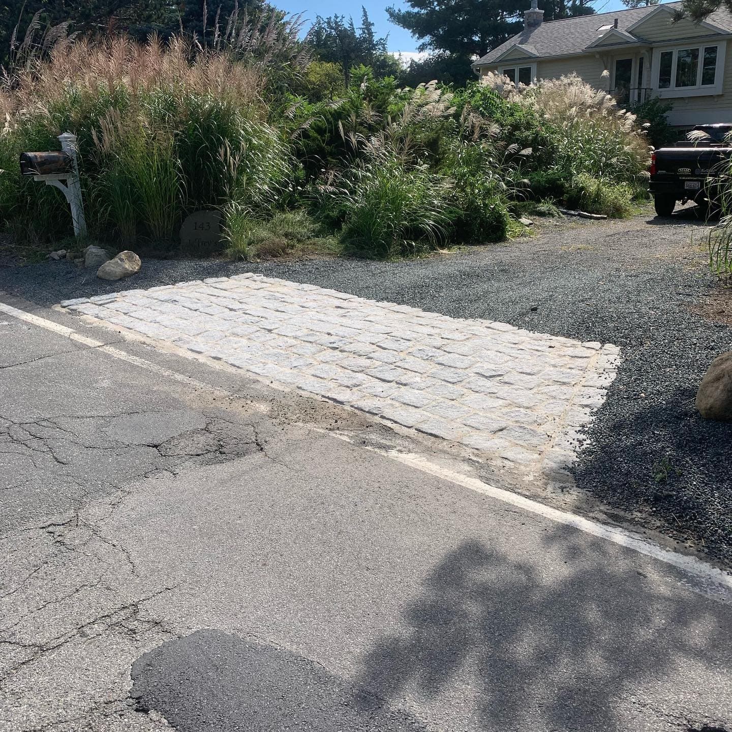 Cobblestone driveway apron at the street