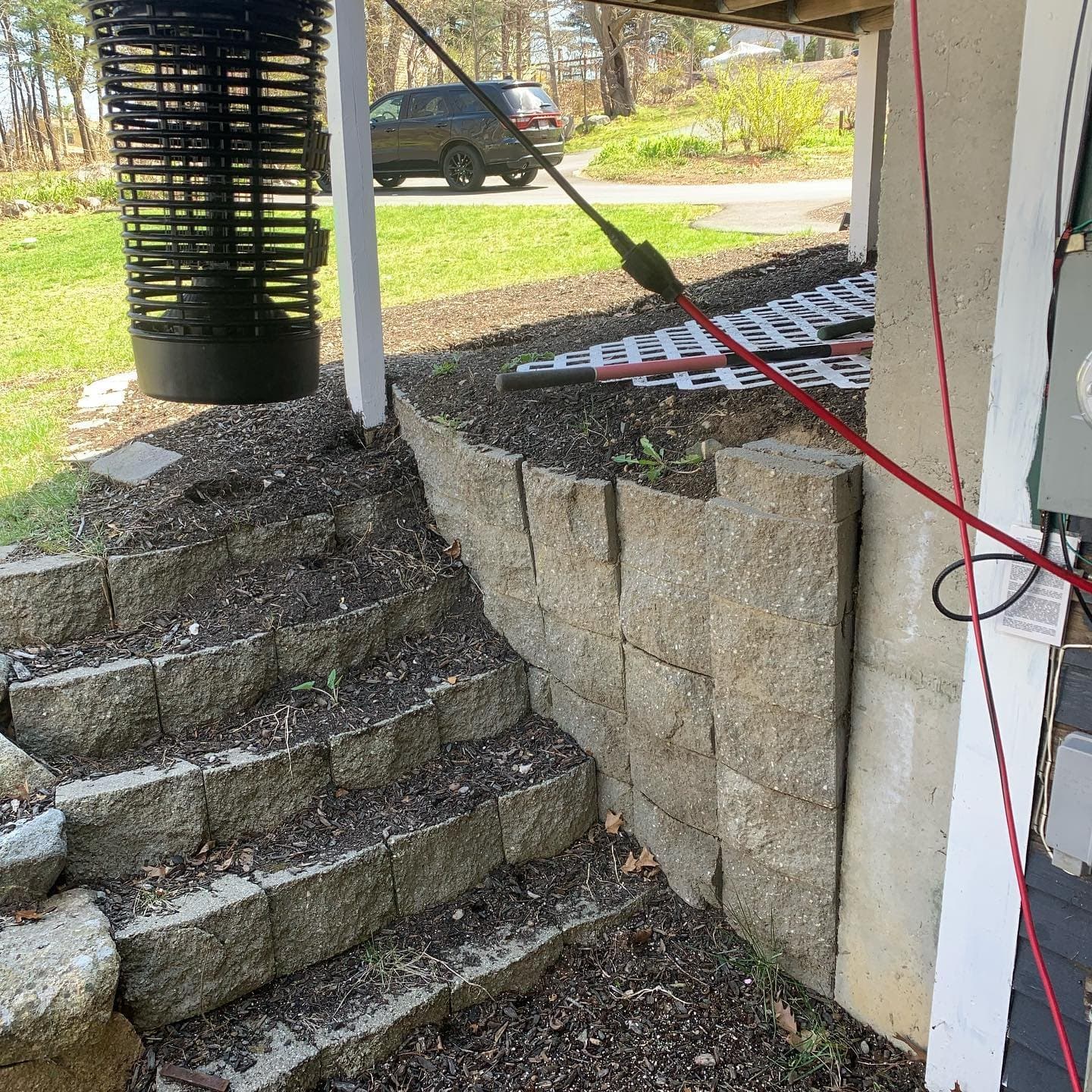 Granite block steps built into a stone retaining wall